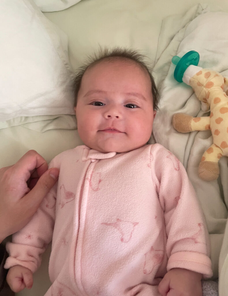 newborn baby smiling